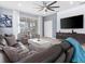 Bright living area featuring a large sectional, modern furniture, and sliding glass doors to the patio at 2221 Lelani Cir, Davenport, FL 33897
