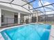 Relax by the screened-in pool and enjoy the Florida sunshine in your private outdoor oasis at 2221 Lelani Cir, Davenport, FL 33897