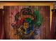 Themed wall decor featuring crest design with wood paneling and artistic flair at 2221 Lelani Cir, Davenport, FL 33897
