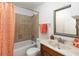 Cozy bathroom featuring tiled shower-tub combination and vanity sink at 2635 Graduate Ct, Orlando, FL 32826