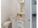 Bathroom featuring a toilet, sink with vanity, and a mirror at 2635 Graduate Ct, Orlando, FL 32826
