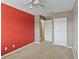 Carpeted bedroom with painted accent wall and standard closet at 2635 Graduate Ct, Orlando, FL 32826