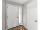 Bright entryway featuring a white front door with sidelight and tile flooring at 2635 Graduate Ct, Orlando, FL 32826