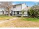 Charming two-story home with landscaped front yard and inviting entrance at 2635 Graduate Ct, Orlando, FL 32826