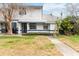 Charming two-story home with landscaped front yard and inviting entrance at 2635 Graduate Ct, Orlando, FL 32826