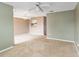Open living room featuring carpet, ceiling fan, and view to dining area at 2635 Graduate Ct, Orlando, FL 32826