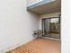 Brick patio with view of the backyard and patio door entrance at 2635 Graduate Ct, Orlando, FL 32826
