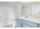 Bright bathroom featuring a shower-tub combo and vanity sink at 2811 Alpine Meadow Ln, Kissimmee, FL 34744