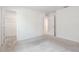 Bright bedroom featuring neutral walls, gray carpet flooring, and walk-in closet at 2811 Alpine Meadow Ln, Kissimmee, FL 34744