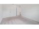 This bedroom features neutral carpet and a closet for organized storage at 2811 Alpine Meadow Ln, Kissimmee, FL 34744