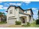 Charming two-story home with well-manicured front lawn and covered entryway at 2811 Alpine Meadow Ln, Kissimmee, FL 34744