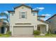 Charming two-story home featuring a two car garage and a neutral color scheme at 2811 Alpine Meadow Ln, Kissimmee, FL 34744