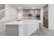 Open kitchen with a center island, stainless steel appliances and grey cabinets at 2811 Alpine Meadow Ln, Kissimmee, FL 34744