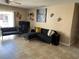 Cozy living room featuring tile flooring, neutral paint and a ceiling fan at 3045 Aaron Burr Ave # P-12E, Winter Park, FL 32792