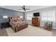 Beautiful bedroom featuring a ceiling fan, patterned accent wall, and warm, inviting decor at 3104 Harrison Ave # A6, Orlando, FL 32804