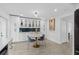 Bright kitchen with white cabinetry, built-in storage, and a breakfast nook at 3104 Harrison Ave # A6, Orlando, FL 32804