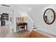 Bright living room showcases tile floors, access to the staircase and a hallway, and stylish decor at 3104 Harrison Ave # A6, Orlando, FL 32804