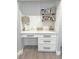 A built-in office nook features white drawers, shelving, and a counter for an efficient workspace at 3104 Harrison Ave # A6, Orlando, FL 32804