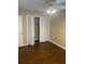 Bedroom with hardwood floors and a closet with louvered doors at 315 Wymore Rd # 207, Altamonte Springs, FL 32714