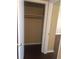 Walk-in closet with hardwood floor, rod and shelf at 315 Wymore Rd # 207, Altamonte Springs, FL 32714