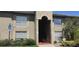 Condominium building exterior with neutral tones and well-maintained landscaping at 315 Wymore Rd # 207, Altamonte Springs, FL 32714