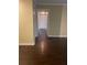 Hallway leading to bedroom with wood-look flooring at 315 Wymore Rd # 207, Altamonte Springs, FL 32714