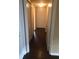Hallway with a hardwood floor and white doors at 315 Wymore Rd # 207, Altamonte Springs, FL 32714