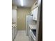 Efficient kitchen with white cabinetry, countertops, and appliances at 315 Wymore Rd # 207, Altamonte Springs, FL 32714