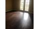 Living room with hardwood floors and glass doors leading to the outside at 315 Wymore Rd # 207, Altamonte Springs, FL 32714