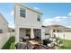 Spacious backyard with a patio area, room for recreation, and a well-kept lawn at 3953 Saltmarsh Loop, Sanford, FL 32773