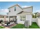 Backyard featuring a screened-in patio, outdoor seating, and manicured lawn at 3953 Saltmarsh Loop, Sanford, FL 32773