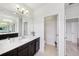 Bathroom with large mirror, solid surface vanity, and a toilet area separated by a doorway at 3953 Saltmarsh Loop, Sanford, FL 32773