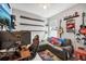 Bedroom boasts shelves, gaming setup, and a seating area, creating a versatile space at 3953 Saltmarsh Loop, Sanford, FL 32773