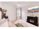 Bright bedroom featuring a cozy seating area, ceiling fan, and a mounted television for relaxation at 3953 Saltmarsh Loop, Sanford, FL 32773