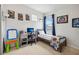 bedroom with grey furniture, a bed with comic book character decorations, and playful art at 3953 Saltmarsh Loop, Sanford, FL 32773