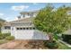Charming front exterior featuring a brick driveway and well-manicured landscaping at 3953 Saltmarsh Loop, Sanford, FL 32773