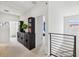 Hallway with decorative accents, access to multiple rooms, and view of the staircase at 3953 Saltmarsh Loop, Sanford, FL 32773