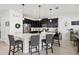 Modern kitchen boasts a large island, stainless steel appliances, and ample cabinet space at 3953 Saltmarsh Loop, Sanford, FL 32773