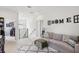 Inviting living area with comfortable seating, natural light, and decorative wall art at 3953 Saltmarsh Loop, Sanford, FL 32773