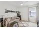 Cozy living area with sofa, rug, and custom wall decor reading 'HOME' at 3953 Saltmarsh Loop, Sanford, FL 32773