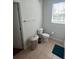 Functional bathroom with neutral tile flooring and white fixtures at 4024 Breakview Dr # 10804, Orlando, FL 32819