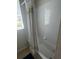 Clean white tiled shower-tub combo with shower curtain and window at 4024 Breakview Dr # 10804, Orlando, FL 32819