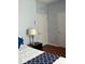Clean bedroom includes two doors, a bedside lamp, and a patterned bedspread at 4024 Breakview Dr # 10804, Orlando, FL 32819