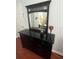 Well-decorated bedroom featuring a dresser with a mirror and a decorative glass at 4024 Breakview Dr # 10804, Orlando, FL 32819