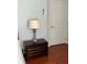 Clean bedroom includes a bedside lamp, a dark wood nightstand, and a patterned bedspread at 4024 Breakview Dr # 10804, Orlando, FL 32819