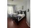 Well-lit twin beds, matching decor, and wood floor offer a cozy feel at 4024 Breakview Dr # 10804, Orlando, FL 32819