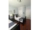 Bright bedroom with twin beds, bedside table and wall decorations at 4024 Breakview Dr # 10804, Orlando, FL 32819