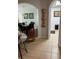 Open hallway with decorative archways, tiled floors, and view of dining room at 4024 Breakview Dr # 10804, Orlando, FL 32819