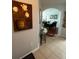 Entryway with tiled floors, hallway leading to dining area, and decorative painting at 4024 Breakview Dr # 10804, Orlando, FL 32819