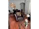 Cozy living room and dining area with an arched opening to the kitchen, a stylish decor, and comfortable seating at 4024 Breakview Dr # 10804, Orlando, FL 32819